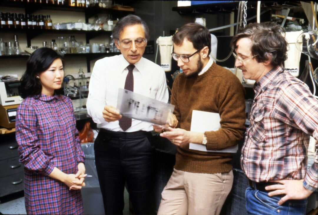 team discussing news sources